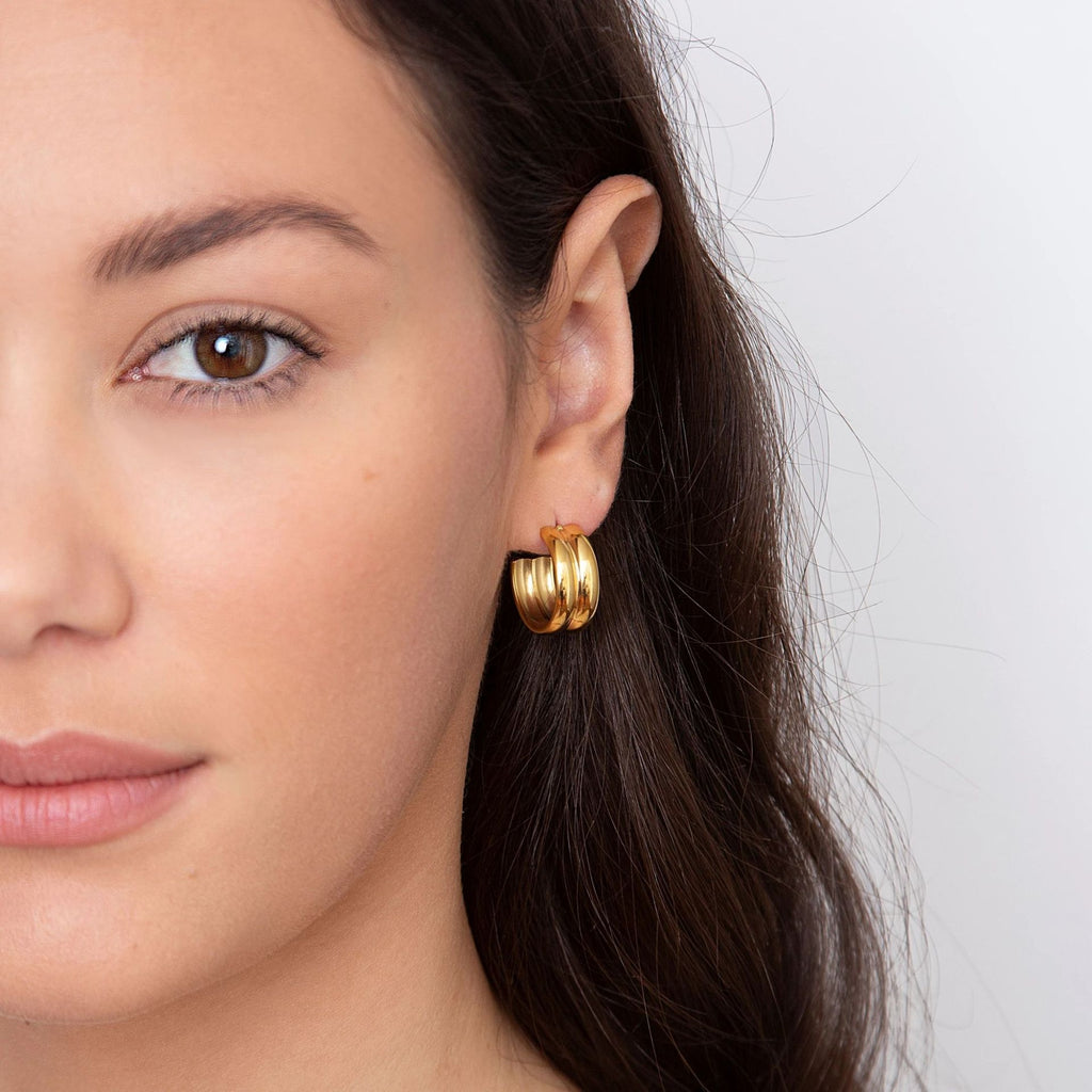 double link gold stud earrings close up detail