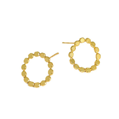 gold square textured stud earrings worn on model ear