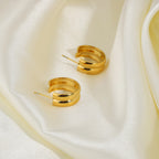 gold double link earrings staggered design styling
