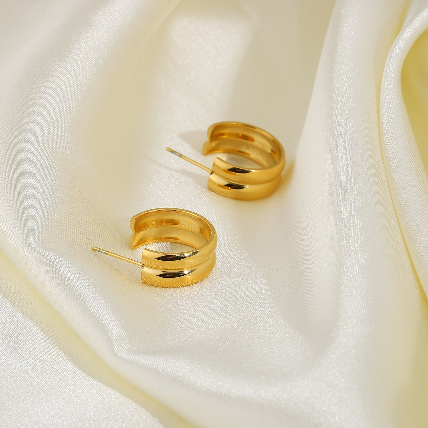 gold double link earrings staggered design styling