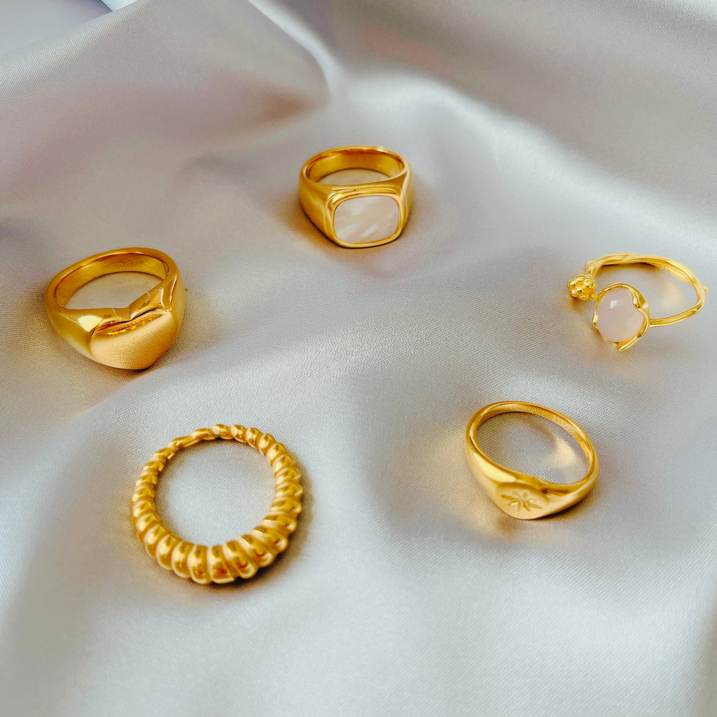 gold wide signet ring close up substantial band