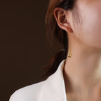rose gold long teardrop earrings detail shot