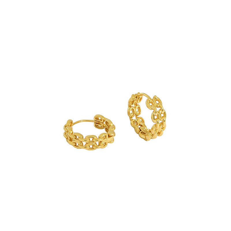 gold chain link hoop earrings worn on model ear