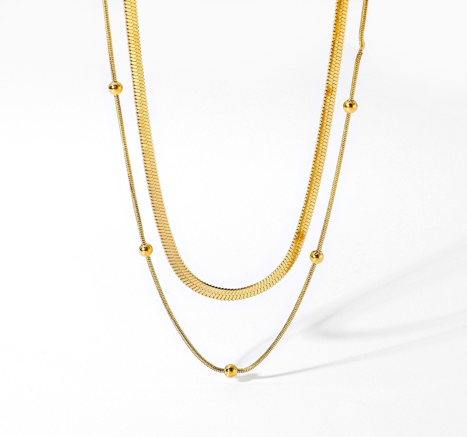 18k gold herringbone choker necklace layering set flat lay - Kaiya London