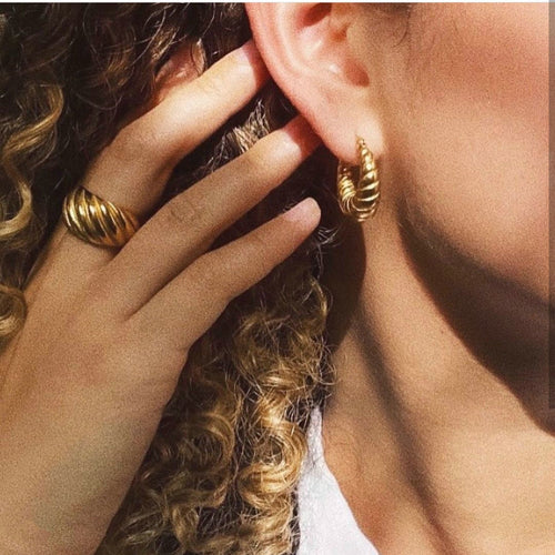textured chunky oval hoop earrings close up detail