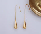 rose gold long teardrop drop earrings on model